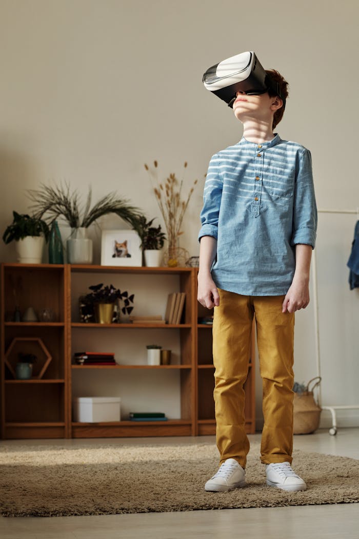 A young boy wearing VR goggles, exploring virtual reality in a cozy living room.